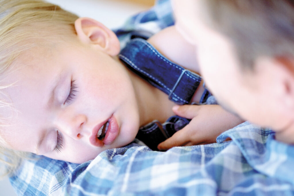 Toddler napping with their mouth open.